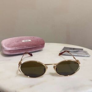 Miu Miu MU 52YS Sunglasses – Gold Frame / Brown Lenses